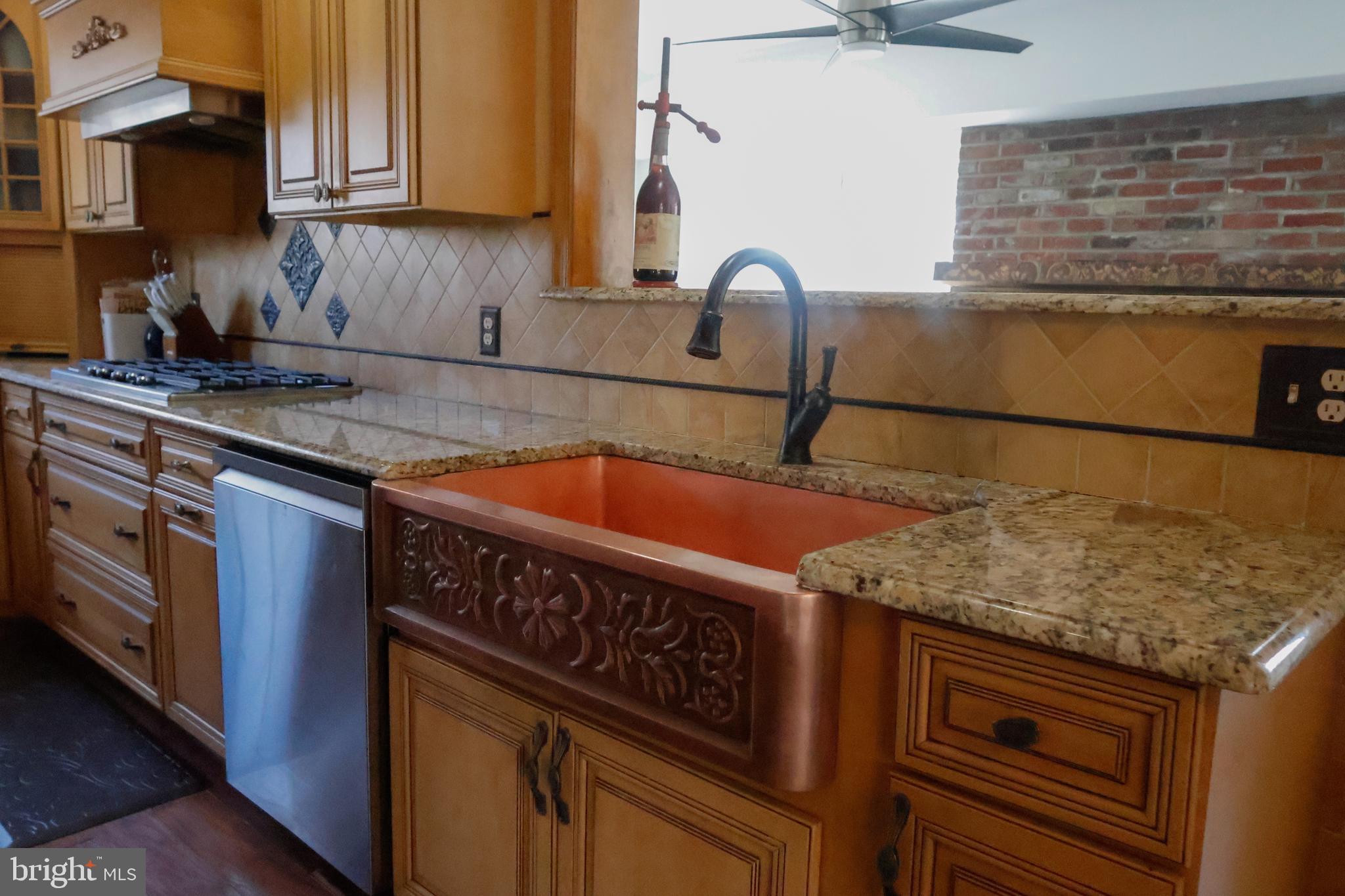 53 Kirkwood Road Gibbsboro, NJ 08026 - Photo 16 of 37 a kitchen with stainless steel appliances granite countertop a sink stove and cabinets