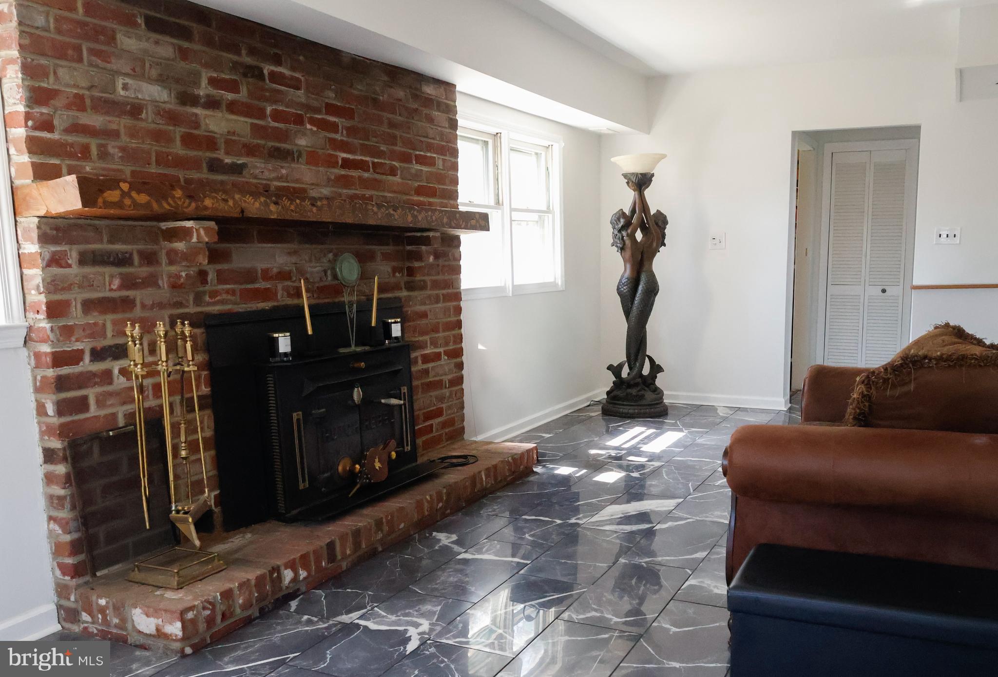 53 Kirkwood Road Gibbsboro, NJ 08026 - Photo 19 of 37 a living room with furniture a flat screen tv and a fireplace