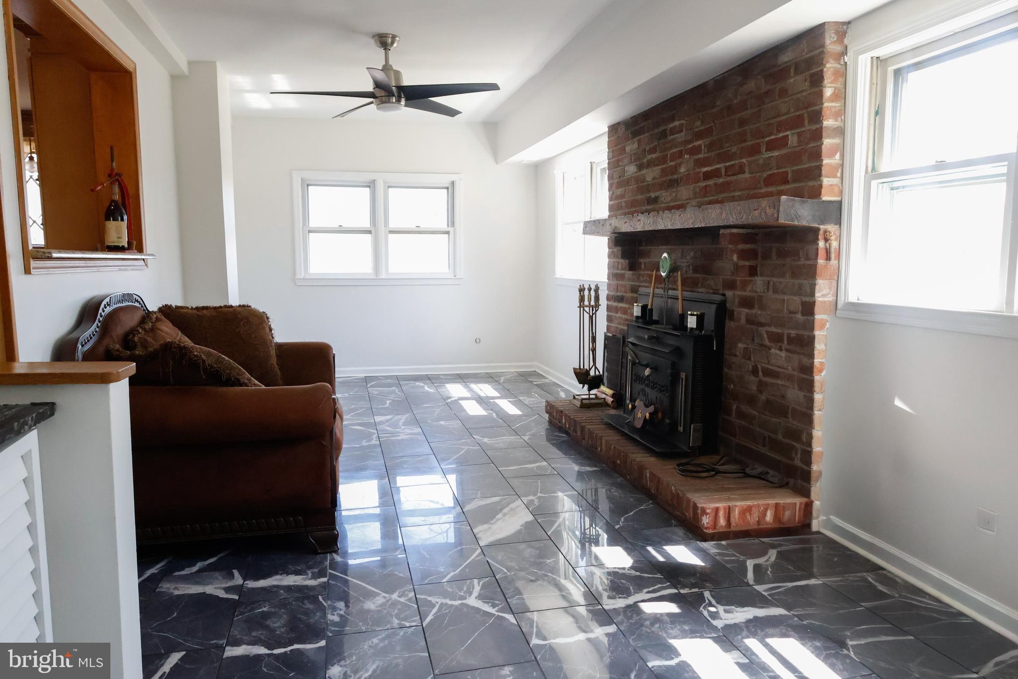53 Kirkwood Road Gibbsboro, NJ 08026 - Photo 20 of 37 a living room with furniture and a fireplace