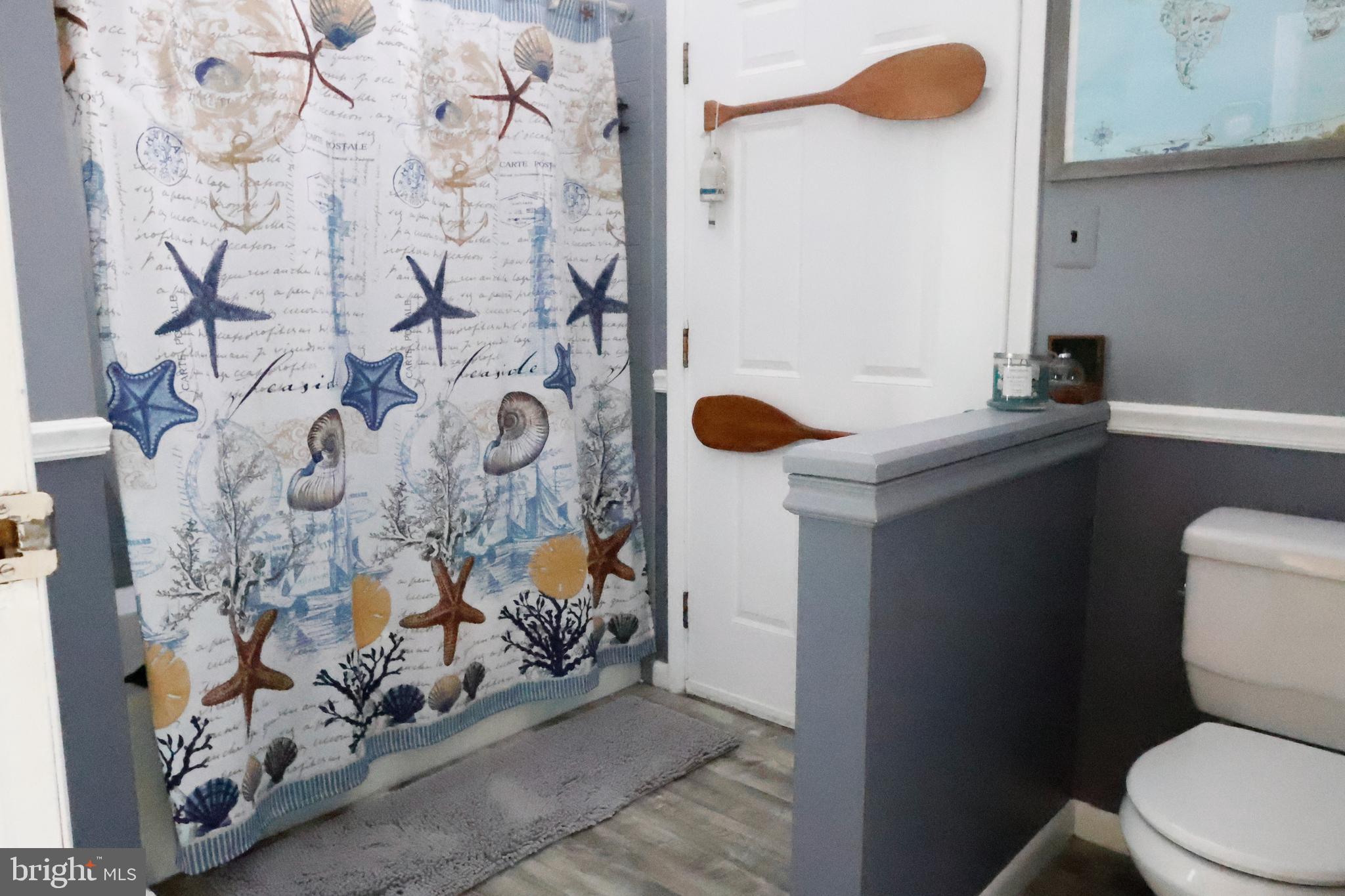 53 Kirkwood Road Gibbsboro, NJ 08026 - Photo 21 of 37 a bathroom with a toilet and a shower curtain