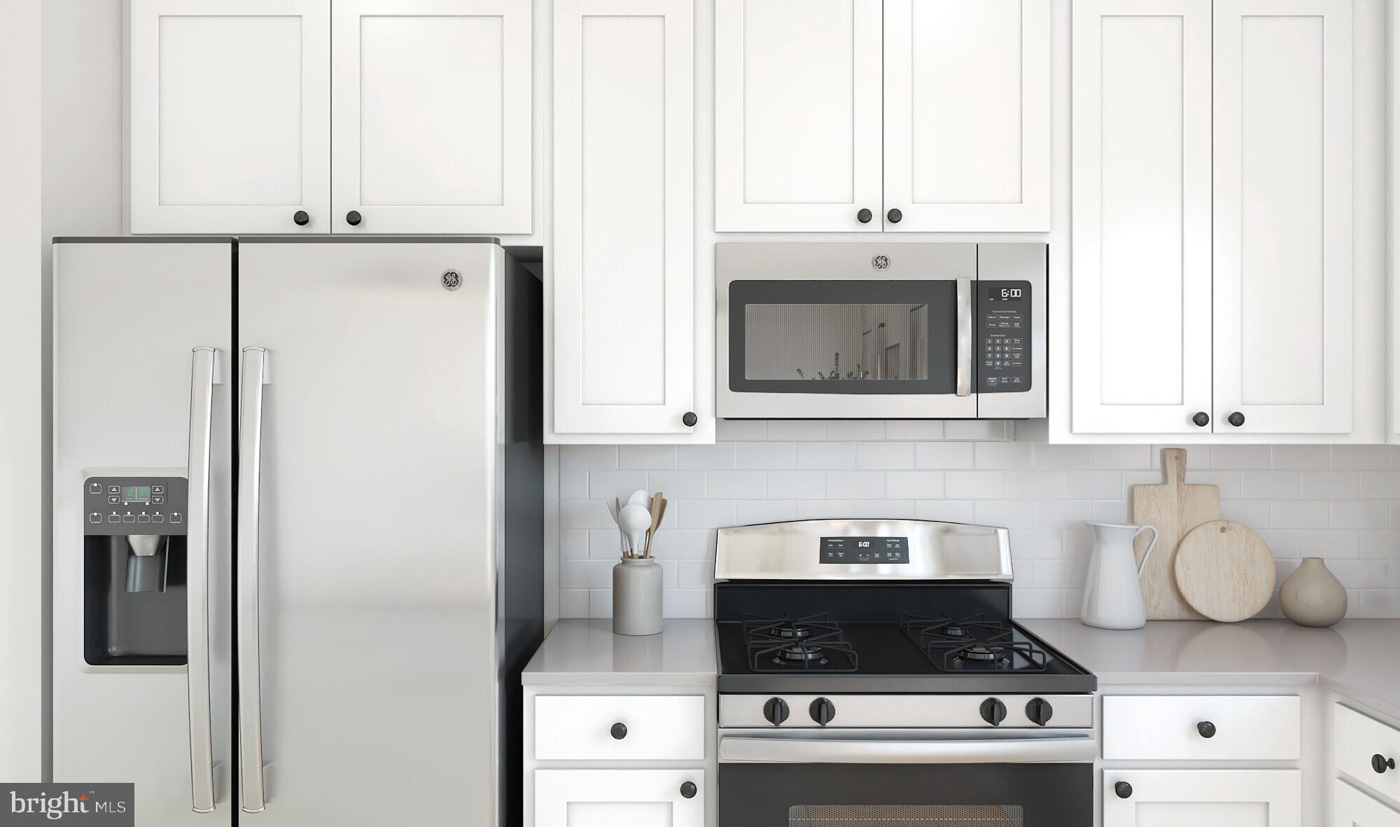 58 Sweetgum Road Berlin, NJ 08009 - Photo 12 of 16 a kitchen with stainless steel appliances granite countertop a stove a refrigerator and a microwave