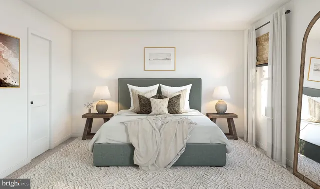 a spacious bedroom with a bed and a window