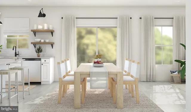 a dining room with furniture and a window