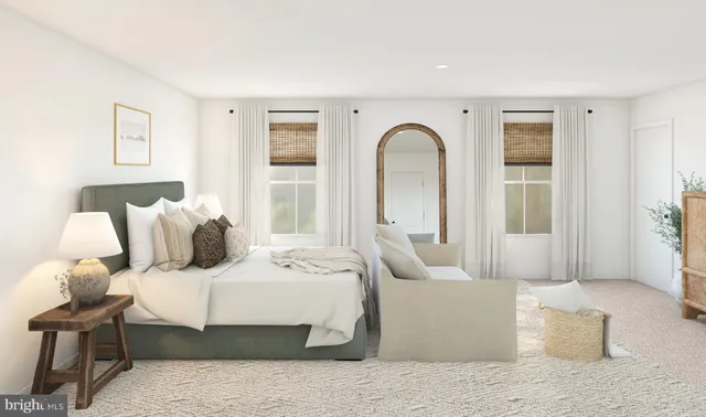 a bedroom with a large bed and a couch