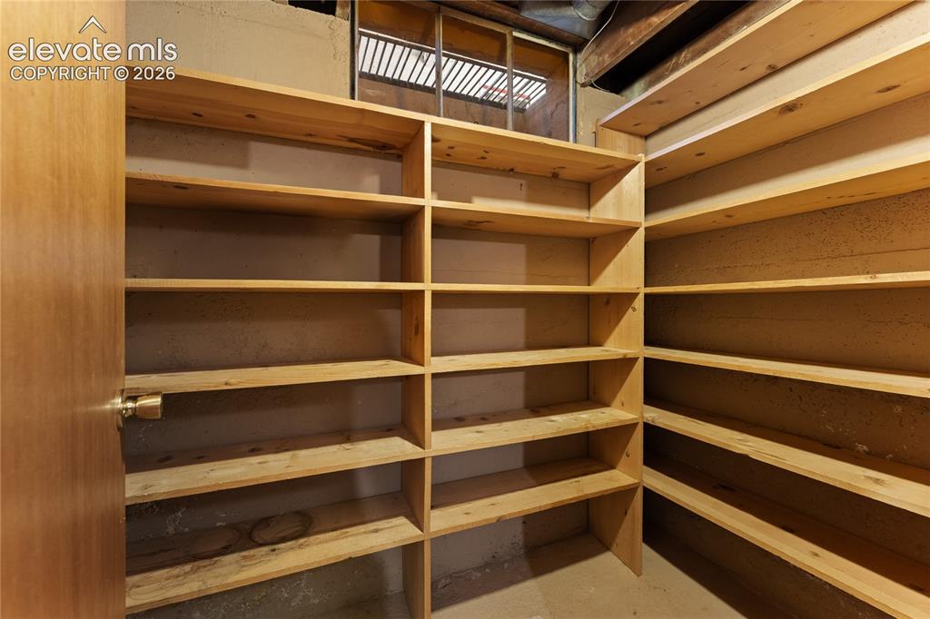 7755 Topeka Avenue Cascade, CO 80809 - Photo 22 of 38 Just opposite the laundry room is this storage room with lots of shelving