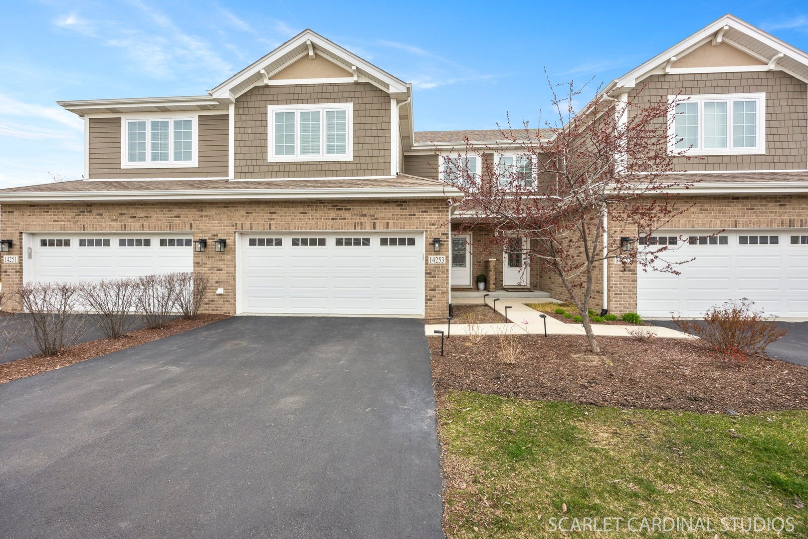 14253 Lacey Drive Lemont, IL 60439 - Photo 2 of 24 a front view of a house with a yard