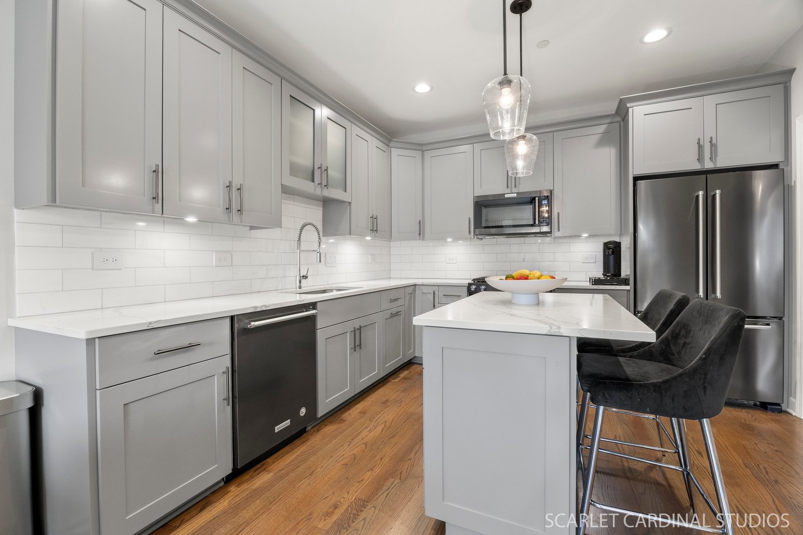 14253 Lacey Drive Lemont, IL 60439 - Photo 5 of 24 a kitchen with kitchen island white cabinets stainless steel appliances a sink and a refrigerator