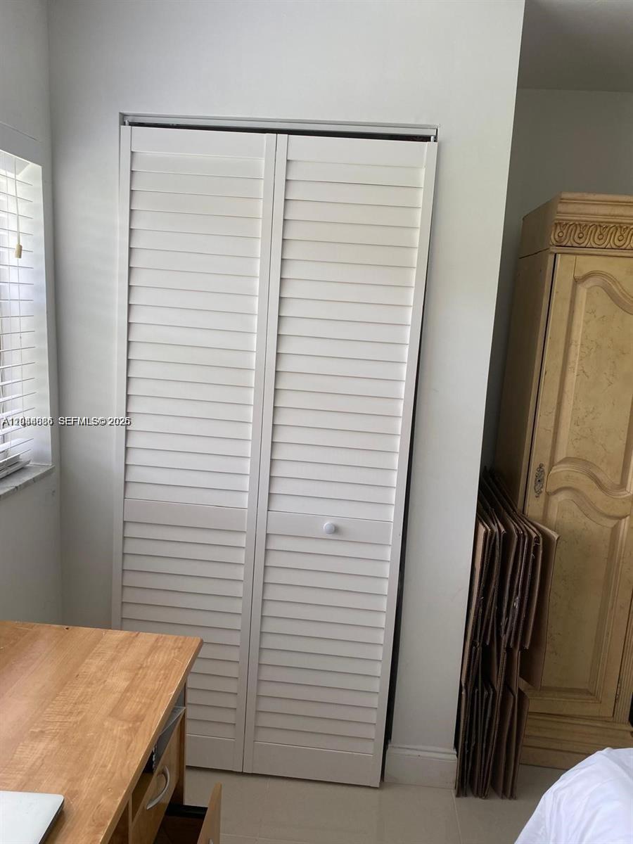 8838 West McNab Road, Unit 104 Tamarac, FL 33321 - Photo 13 of 23 a view of a hallway with entryway