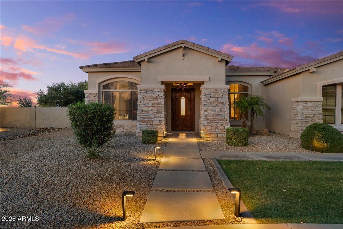 6427 South Magic Court Gilbert, AZ 85298 - Photo 66 of 71 a front view of a house with garden