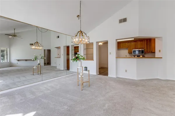 a view of a livingroom with furniture and a chandelier