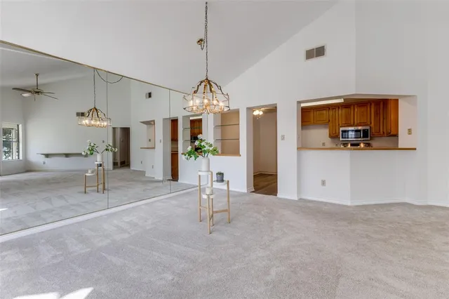 a view of a livingroom with furniture and a chandelier