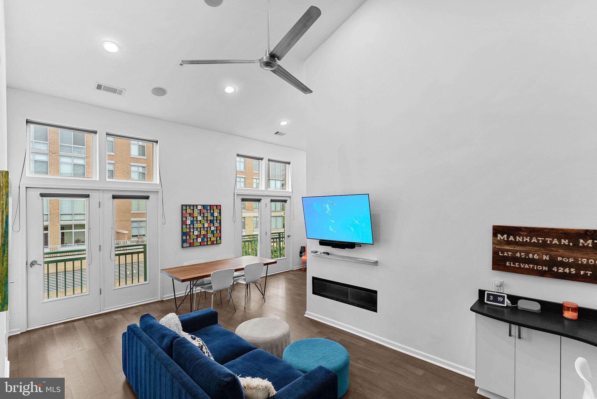 12000 Market Street, Unit 428 Reston, VA 20190 - Photo 14 of 105 Large windows and doors with custom shades!