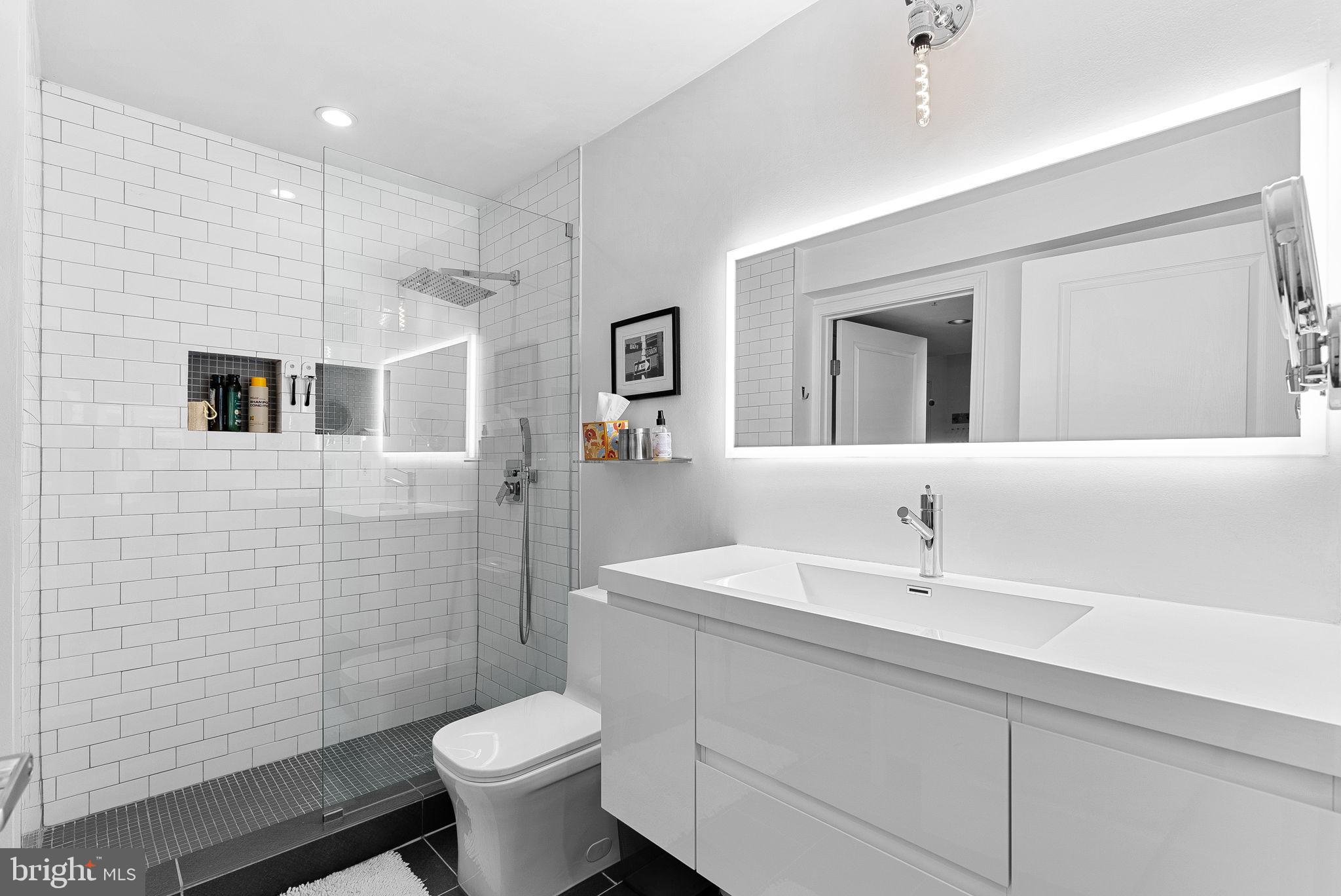 12000 Market Street, Unit 428 Reston, VA 20190 - Photo 29 of 105 Main bathroom filled with elegant upgrades!
