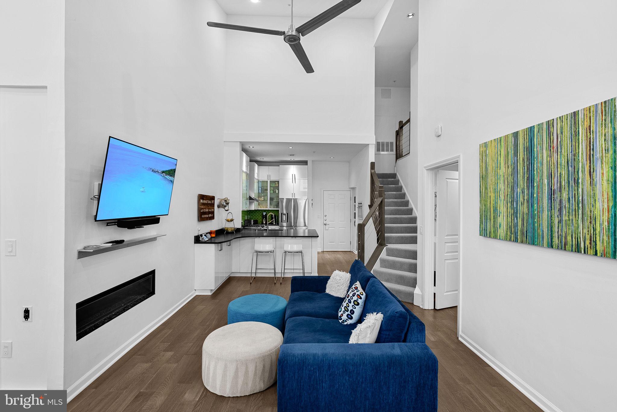 12000 Market Street, Unit 428 Reston, VA 20190 - Photo 10 of 105 Contemporary fireplace, ceiling fan too