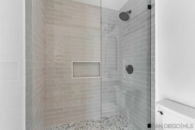 a kitchen with stainless steel appliances a refrigerator sink and cabinets