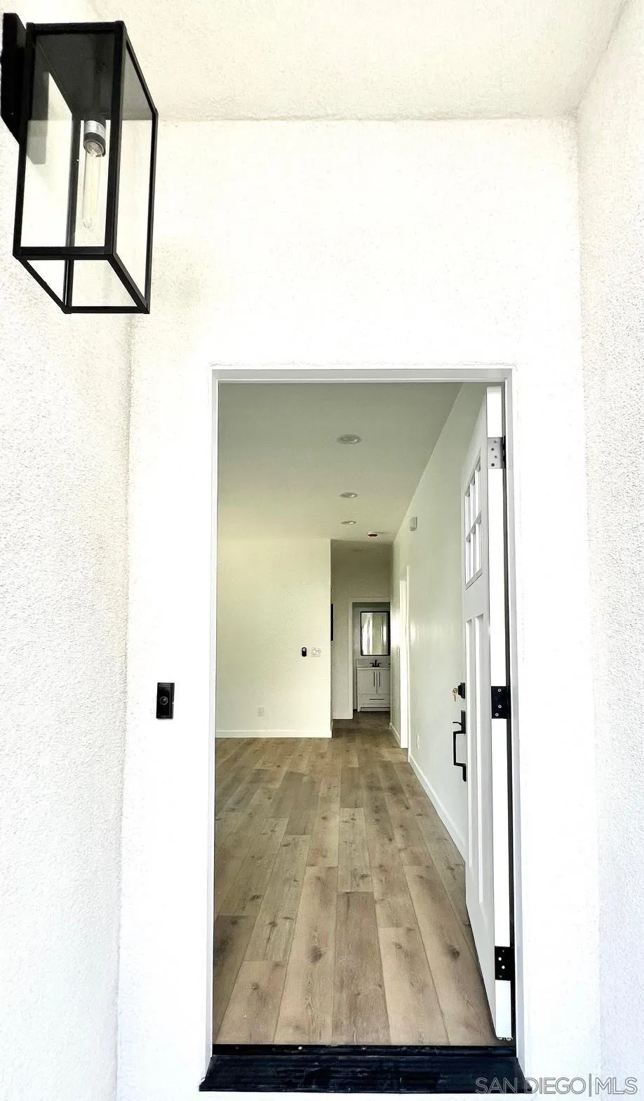 4922 Muir Avenue San Diego, CA 92107 - Photo 18 of 56 a view of a hallway with wooden cabinet