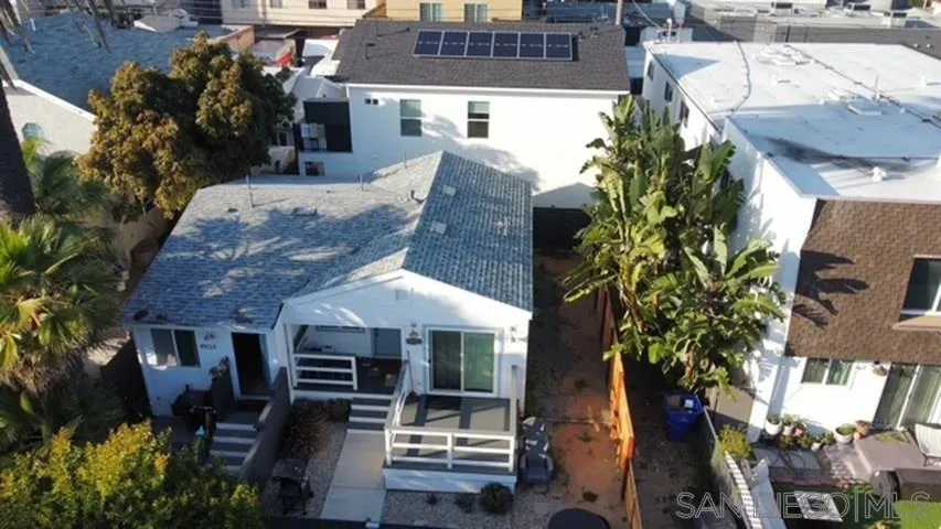 4922 Muir Avenue San Diego, CA 92107 - Photo 2 of 56 a front view of a house with a garden
