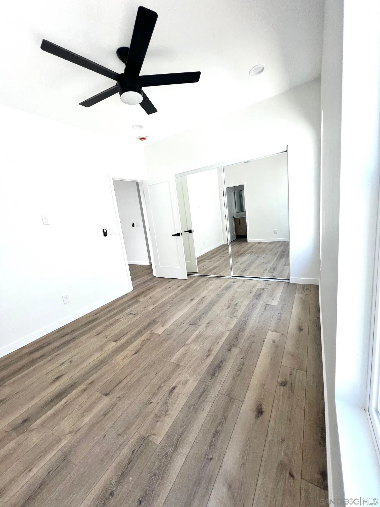 4922 Muir Avenue San Diego, CA 92107 - Photo 21 of 56 a view of empty room with wooden floor