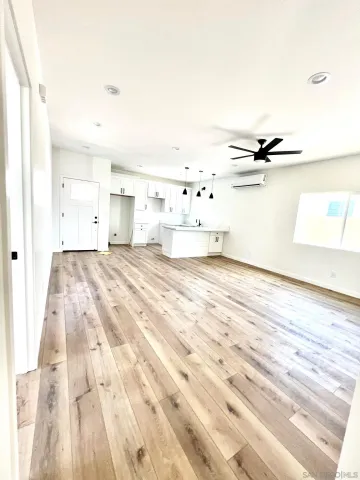 a bedroom with a bed and a night stand