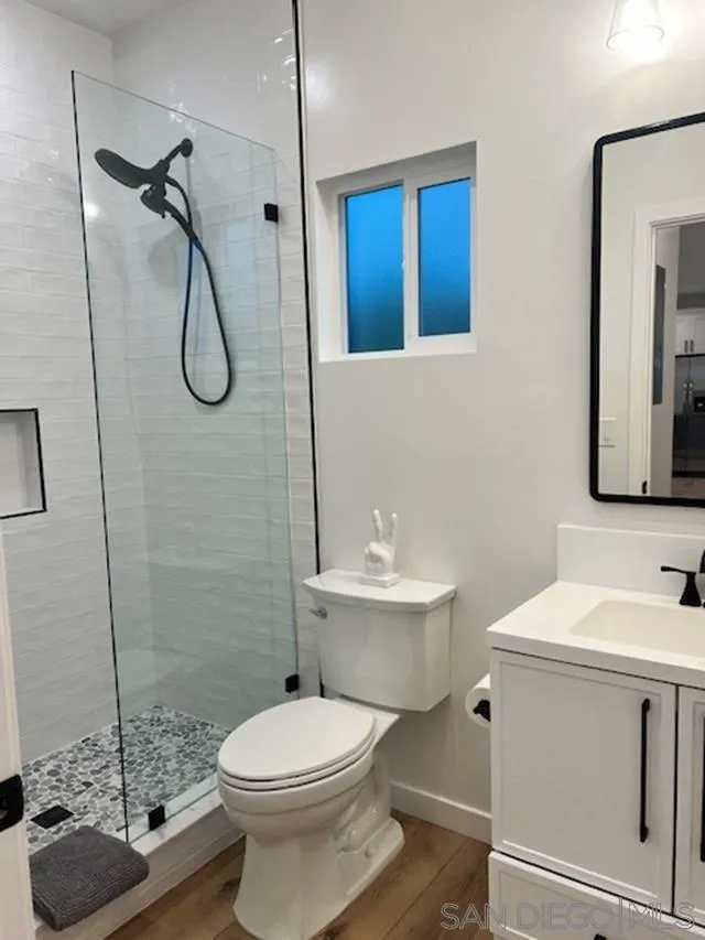 4922 Muir Avenue San Diego, CA 92107 - Photo 31 of 56 a bathroom with a sink a toilet and shower