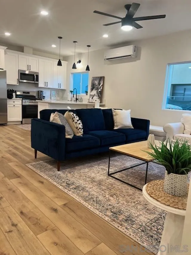 4922 Muir Avenue San Diego, CA 92107 - Photo 35 of 56 a living room with furniture and kitchen view