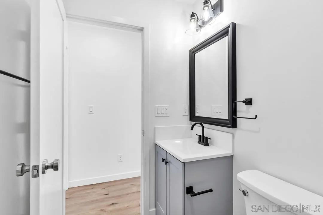 4922 Muir Avenue San Diego, CA 92107 - Photo 45 of 56 a bathroom with a sink a toilet and shower