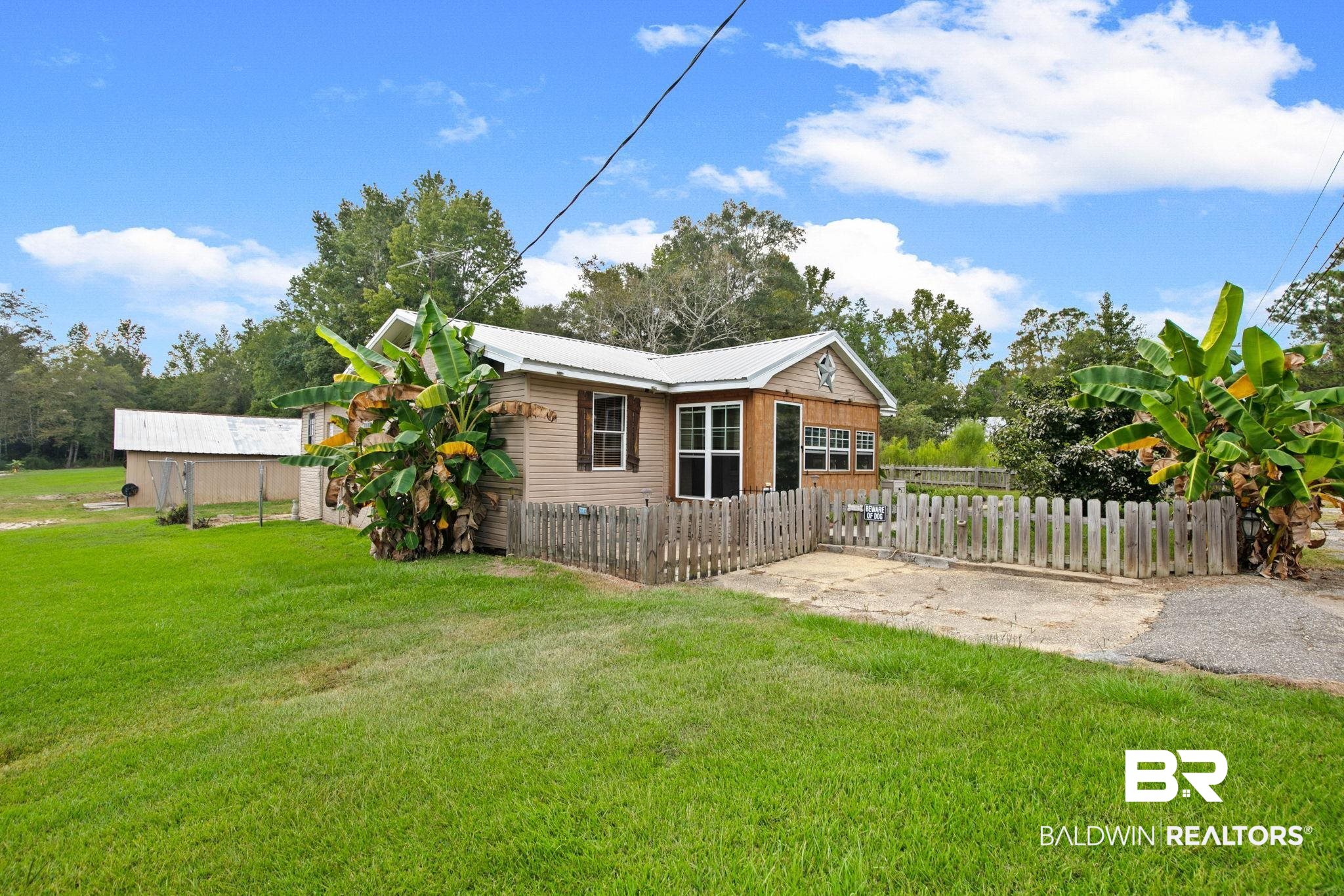 23240 County Road 47 Perdido, AL 36562 - Photo 3 of 29 View of property exterior with a fenced front yard