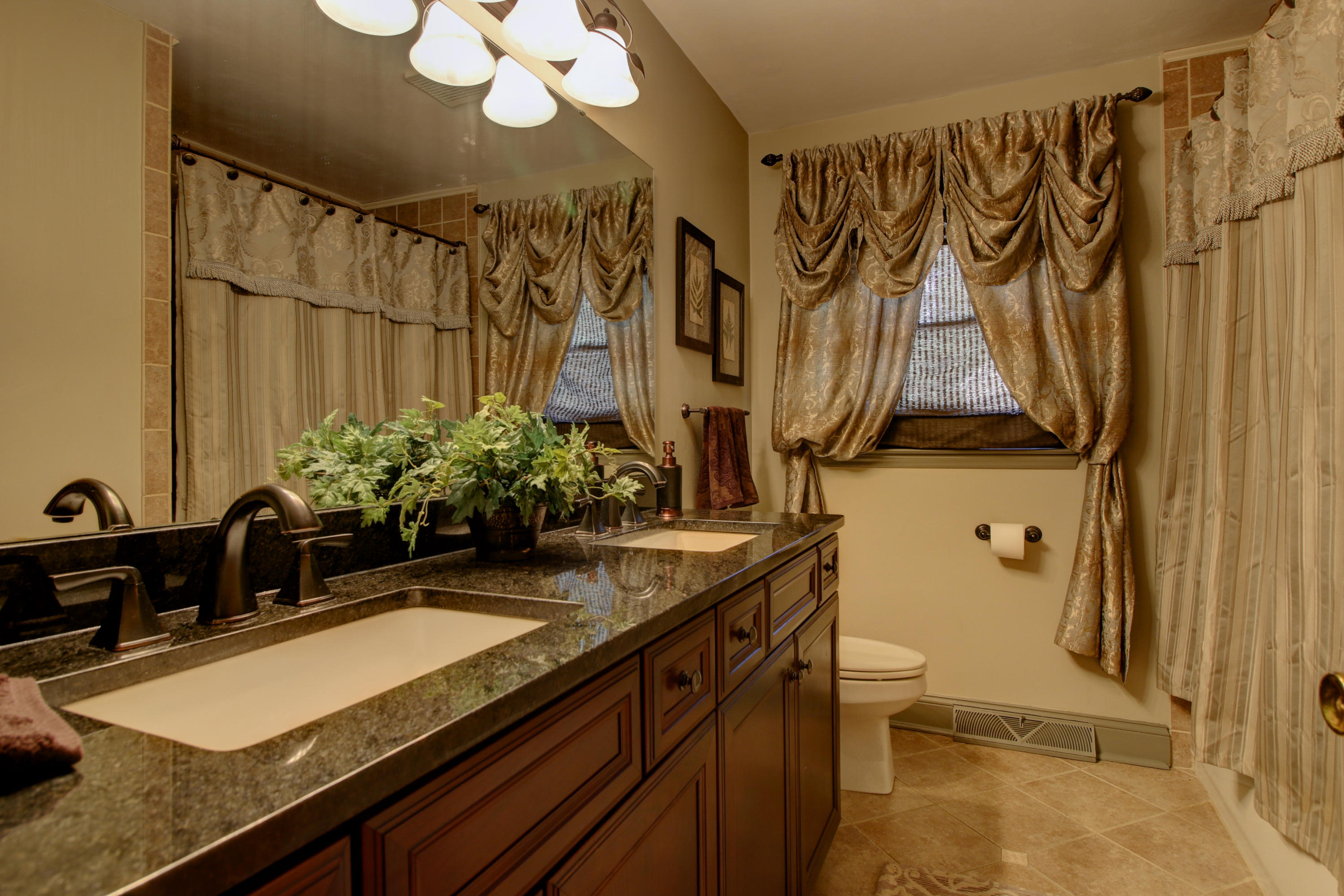 67 Walnut Drive Blue Ridge, VA 24064 - Photo 14 of 57 a bathroom with a granite countertop sink and a mirror