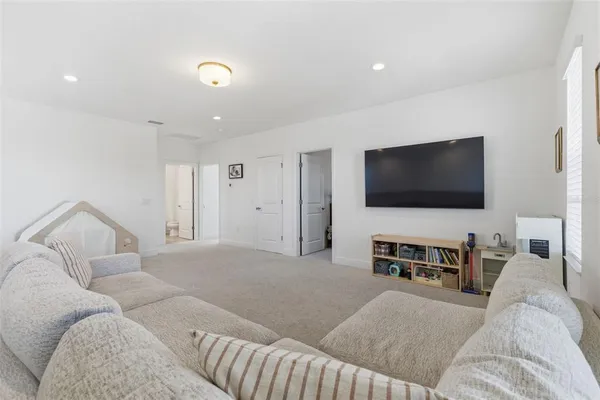a bathroom with a sink double vanity granite tub shower and a mirror