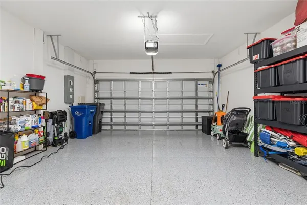 a room with pool table flat screen tv and outdoor seating