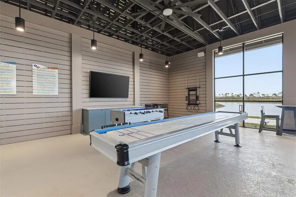 a view of swimming pool with outdoor seating and city view
