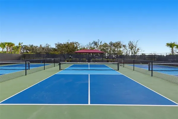 an aerial view of a house with garden space and sitting area