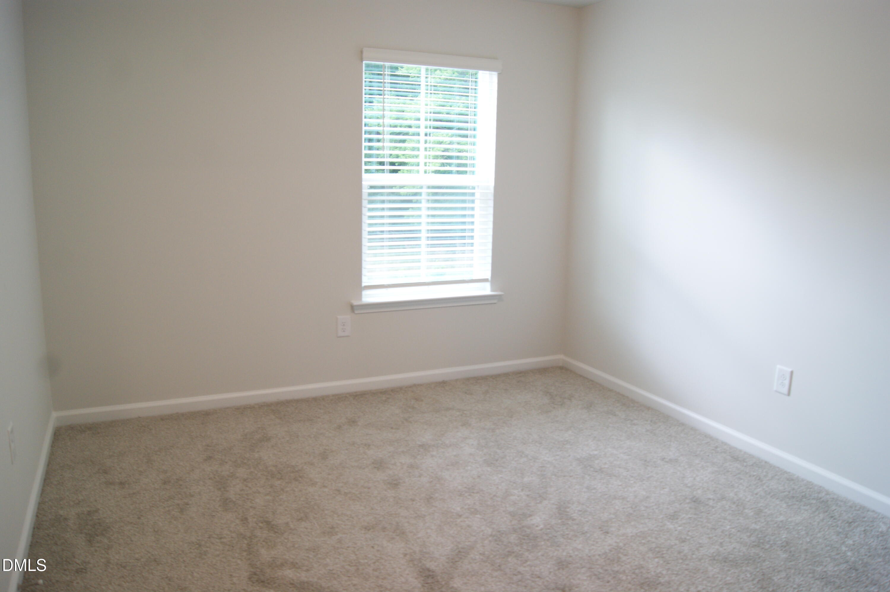 295 Glenmore Gardens Road Raleigh, NC 27603 - Photo 19 of 30 an empty room with a window