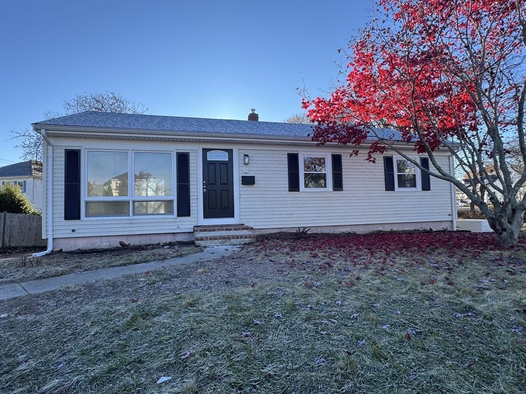 a view of a house with a yard