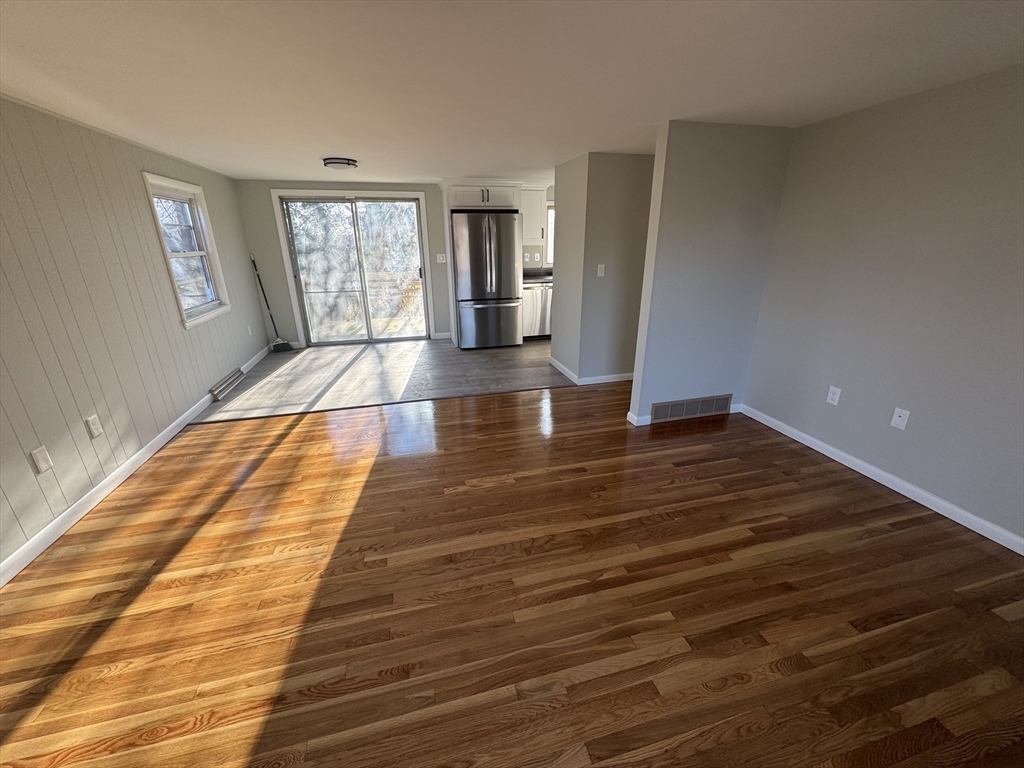 8 Nicks Rock Road, Unit 1 Plymouth, MA 02360 - Photo 12 of 27 a view of empty room with window and wooden floor