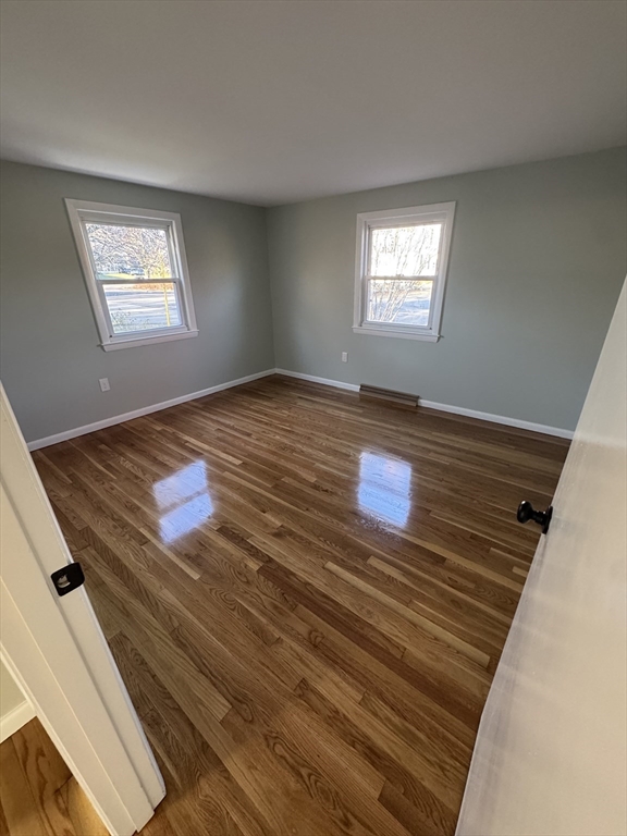8 Nicks Rock Road, Unit 1 Plymouth, MA 02360 - Photo 14 of 27 a view of empty room with window and ceiling fan