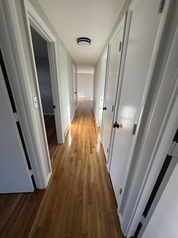 8 Nicks Rock Road, Unit 1 Plymouth, MA 02360 - Photo 16 of 27 a view of a hallway with wooden floor and stairs
