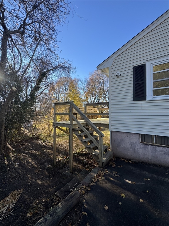 8 Nicks Rock Road, Unit 1 Plymouth, MA 02360 - Photo 20 of 27 a view of a house with a yard
