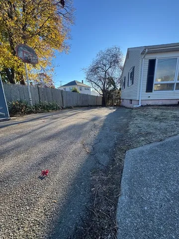 a view of a house with a backyard