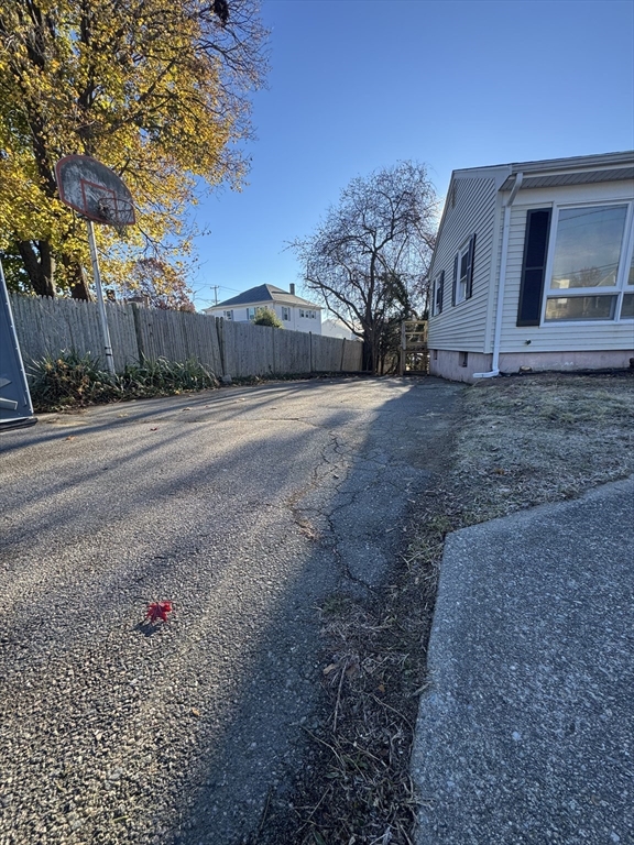 8 Nicks Rock Road, Unit 1 Plymouth, MA 02360 - Photo 26 of 27 a view of a house with a backyard