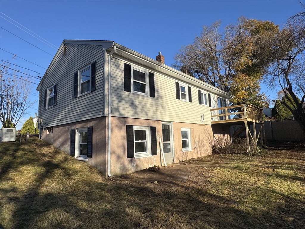 8 Nicks Rock Road, Unit 1 Plymouth, MA 02360 - Photo 5 of 27 a front view of a house with a yard