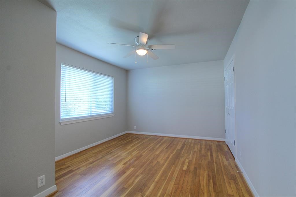 5611 Arboles Drive Houston, TX 77035 - Photo 12 of 13 wooden floor in an empty room with a window