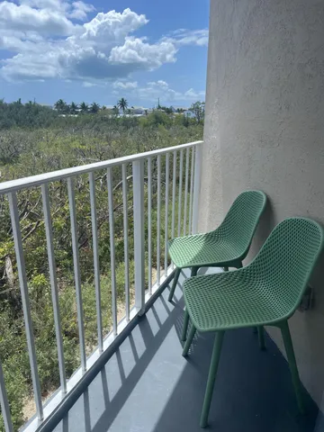 a view of a chair in a balcony