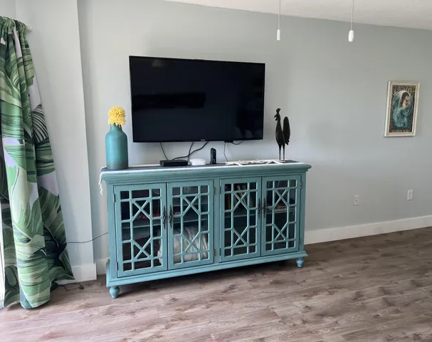 a room with furniture and a flat screen tv