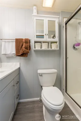 a bathroom with a toilet sink and window