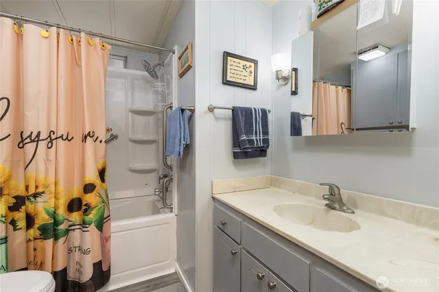 a bathroom with a sink a bathtub and a shower