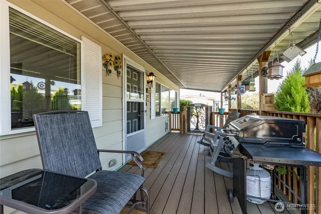 a view of a chairs and table on the deck