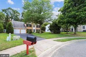 a front view of a house with a yard table and chairs