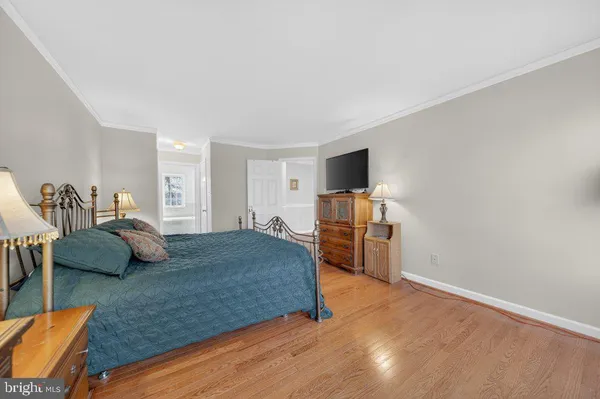 a bedroom with furniture and a bed