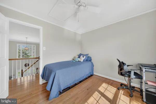 a bed room with a bed and a chair